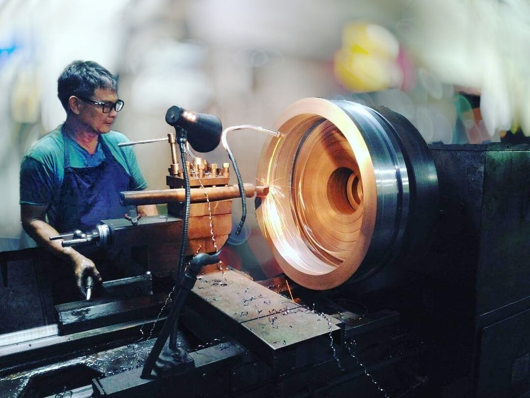Founder machining a component at the lathe