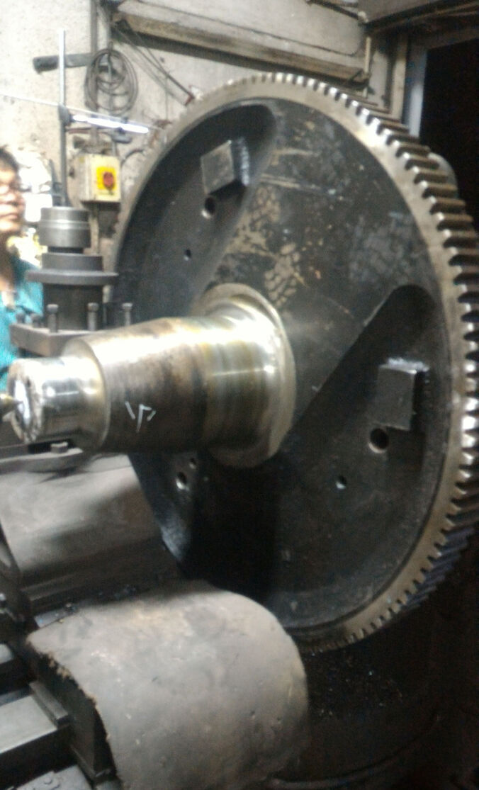 Large ring gear and shaft being machined on lathe